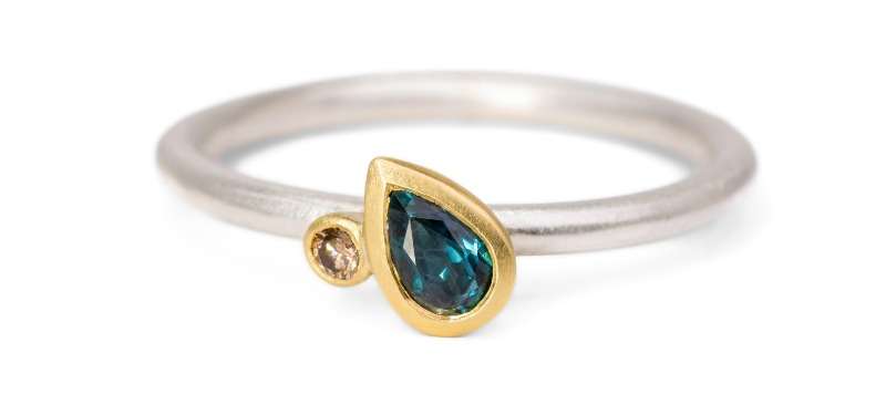 Pear cut teal blue sapphire and champagne diamond Fairmined gold and silver ring Pear cut teal blue sapphire and champagne diamond Fairmined gold and silver ring Victoria Jarman Jewellery